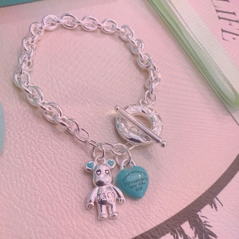 Tiffany & Co. Silver Charm Bracelet with Blue Heart and Bear